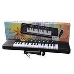 Пианино с микрофоном в коробке Размер:50х14х3см арт. XH-322A
